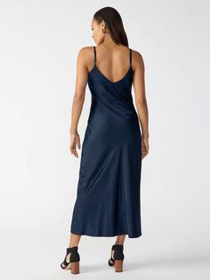 This Slip Midi Dress is a great staple for your closet. Wear it for any event you have and feel confident wearing it. It's relaxed fit is flattering on all body types. Also has features like adjustable straps and a v-neck neckline FABRIC + CARE 71% Viscose 29% Polyester Fabric disclaimer- This garment is dyed with unique dyes and/or indigo. Dark colors may rub off on light colored fabric or upholstery. Important, please follow the labeled care instructions for the best maintenance of this garmen Midi Dress Navy, Slip Midi Dress, Dress Length, Dress Skirt, Polyester Fabric, Slip Dress, Midi Dress, Relaxed Fit, V Neck