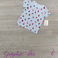 Dotdotsmile Graphic Tee Former Merchandiser Brand New With Tags Size 6 Light Blue T-Shirt With Red And Pink Strawberries Polka Dot Cotton T-shirt With Short Sleeves, Cotton T-shirt With Polka Dot Pattern And Short Sleeves, Cute Polka Dot Top For Spring, Cute Spring Polka Dot Tops, Polka Dot Short Sleeve T-shirt For Spring, Trendy Polka Dot Short Sleeve Tops, Trendy Short Sleeve Tops With Polka Dot Pattern, Trendy Polka Dot Cotton Tops, Fun Cotton Tops With Fruit Print