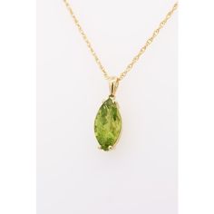 6.88 Carat Peridot Solitaire Pendant Necklace in 14K Yellow Gold Rope Chain. Statement pendant necklace with an astonishing marquise cut, 2-prong set peridot stone dangling from the chain in a vibrant yellowish-green color. The contrast of the yellow gold with the lime green of the rope chain is a sight to be seen. The pendant would pair and layer perfectly with other simpler gold colored necklaces. The pendant is 18 inches long and weighs 1.69 grams. The stone measures 25 x 9 mm and bears moderate cleanliness with excellent color.   Item Details: Item Type: Pendant Necklace Gemstone: Peridot Metal: 14K Yellow Gold Closure: Spring Ring Chain Type: Rope chain Weight: 1.69 Grams Length: 18 inches  Gemstone Details: Type: Peridot Carat: 6.88 Cut: Marquise Color: Yellowish Green  Setting: 2 pr Classic Marquise Jewelry For May Birthstone, Classic Marquise May Birthstone Jewelry, Fine Jewelry Green Marquise Necklaces, Green Marquise Birthstone Jewelry, 14k Gold Marquise May Birthstone Jewelry, Formal Green Marquise Jewelry, Green Marquise 14k Gold Jewelry, Green Marquise Jewelry For May Birthstone, Green Marquise May Birthstone Jewelry