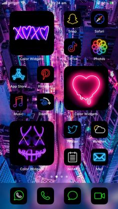 an iphone screen with neon lights on it and the cityscape in the background