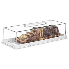 a cake in a glass box on a white background