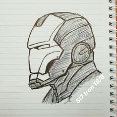 a drawing of a helmet on top of a notebook