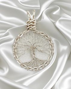 This Tree of Life pendant was artistically crafted using sterling silver wire. The trunk of the tree is anchored to a circular frame created from twisted sterling silver wire that was hammered flat. The pendant measure 1 3/8" wide and 1 3/4" long from the top of the bail to the roots of the tree. It is suspended from your choice of a 16" or 18" sterling silver diamond cut bead chain with lobster claw clasp. Just choose the one you want in the pull down menu when ordering. The Tree of Life is a u Indian Hills, Circular Frame, The Tree Of Life, Silver Tree, Tree Of Life Necklace, Tree Of Life Pendant, Bead Chain, The Roots, Hammered Silver