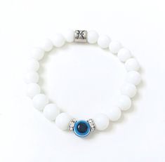 Evil Eye Bracelet This semi-precious Evil Eye matte white Onyx bracelet provides powerful vibrations of protection. In addition to providing protection and strength, the evil eye symbol is believed to bring blessings and protection.  Features: *This listing is for 1 bracelet with your choice of White Onyx or Black Tourmaline * White Matte Onyx 8 mm  * Evil Eye bead 8mm  * Crystal or Silver spacer 6mm * Zodiac Sign Zinc Alloy Bead 8mm  * Strong Stretch Cord It is very important to keep your gemst White Evil Eye Bracelet, White Adjustable Beaded Bracelets With Evil Eye, White Evil Eye Bracelet With 8mm Beads As Gift, White Evil Eye Beaded Bracelets, Elegant White Round Evil Eye Bracelet, White Round Evil Eye Bracelet, White Evil Eye Bracelet Gift, Spiritual White Evil Eye Bracelets, White Evil Eye Beaded Bracelet