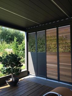 an outdoor patio with wooden slats on the walls