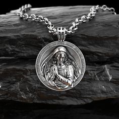 This silver necklace is handmade by Burning Ship Metalworks. It is made from recycled silver. A Renaissance-inspired version of Virgin Mary pendant, cast in .925 sterling silver, and handmade with a lot of love. Cast with a nice bright polished finish that will keep it shiny for a long time to come. The Virgin Mary is making an appearance in churches across the world. An increase in the popularity of this religious icon has set new records for sales, creating a great demand for items such as fig Silver Medallion Pendant Necklace With Polished Finish, Silver Pendant Medallion Necklace With Polished Finish, Silver Medallion Necklace With Polished Finish, Stainless Steel Pendant Locket Jewelry, Amulet Pendant Jewelry For Memorial, Memorial Pendant Jewelry With Charms, Hallmarked Stainless Steel Pendant Necklace, Symbolic Memorial Pendant Jewelry, Polished Stainless Steel Pendant Necklaces