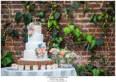 a white wedding cake sitting on top of a table