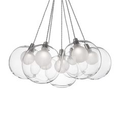 a chandelier with five clear glass balls hanging from it's metal rods