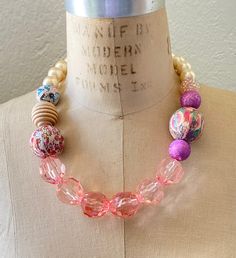 Feminine shades of pink with handmade decoupage beads covered in vintage prints Spring Pink Beaded Necklace, Handmade Pink Necklaces For Spring, Pink Bohemian Necklace With Large Beads, Vintage Pink Beaded Necklace As A Gift, Pink Large Beads Necklace For Party, Handmade Pink Beaded Necklace For Summer, Pink Beaded Necklace With Large Beads For Party, Pink Round Beads Necklace For Spring, Adjustable Pink Necklace With Large Beads