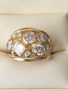 a close up of a ring with diamonds on it