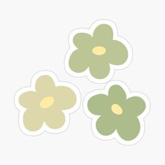 three flower stickers sitting on top of each other