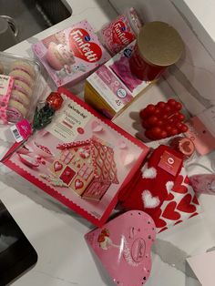 valentine's day treats are laid out on the kitchen counter for someone to decorate