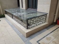 a glass table sitting on the side of a building