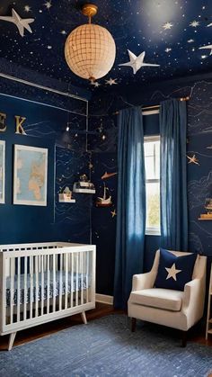 a baby's room with blue walls and stars on the ceiling