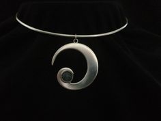 Crescent Moon Torc is made from Sterling silver (925) and hallmarked by The Goldsmiths` Company, London Assay office. Every Moonstone is carefully selected for its beauty and luminous qualities. Laluna  is a unique silvercraft that alchemically combines the power of metals and gemstones, to forge symbolic jewellery. Inspiration for this collection is drawn from ancient ritual, magick, and the moon. Each piece has been designed and handcrafted in harmony with the lunar phases and her energy. Lalu Formal Silver Jewelry With Moon Charm, Formal Moon Phase Sterling Silver Jewelry, Silver Jewelry With Moon Charm For Formal Occasions, Modern Silver Spiral Jewelry, Elegant Silver Jewelry With Sun And Moon Design, Elegant Silver Sun And Moon Design Jewelry, Formal Silver Necklace With Moon Charm, Silver Necklace With Moon Charm For Formal Occasions, Formal Silver Moon-shaped Jewelry