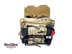 a multicamo pouch with multiple items in it