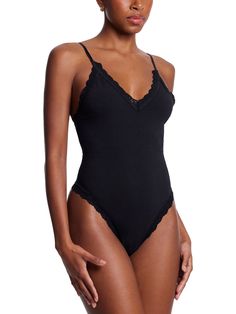 What do you get when you combine a thong with a leggy bodysuit? A one-piece wonder. This soft Supima® Cotton bodysuit is a soft and comfortable cotton layer that’s easy to wear and feel good in. Style it to go out or wear it at home with sweats. Women's sleepwear, lingerie and more, from Hanky Panky. Chic Seamless Bodysuit For Loungewear, Solid Loungewear Bodysuit With Lined Body, Lined Loungewear Bodysuit In Solid Color, Solid Color Loungewear Bodysuit With Lined Body, Elegant Seamless Bodysuit For Loungewear, Elegant Lined Bodysuit For Loungewear, Chic One-piece Bodysuit For Loungewear, Women's Sleepwear, Bodysuit Black