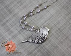 "This fine silver floral bird necklace is a show stopper. The delicate filigree pattern in the bird is oxidized to a lovely dark color to bring out the design. The bird is suspended from a row of white freshwater pearls and a delicate sterling silver chain. The bird is handmade using precious metal clay that is fired leaving the end result of only fine silver (.999), all other pieces are fully sterling silver (.925). Necklace arrives neatly packaged and ready to wear and enjoy, or give as a gift Elegant Silver Necklace With Bird Shape, Filigree Pattern, Precious Metal Clay, Bird Necklace, Cameo Necklace, Sterling Silver Cuff Bracelet, White Freshwater Pearl, Silver 925 Necklace, Metal Clay