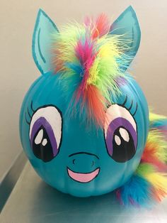 an inflatable toy with multi - colored hair on it's head and eyes