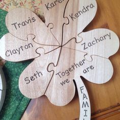 four pieces of wood with words on them sitting next to a clock and other items