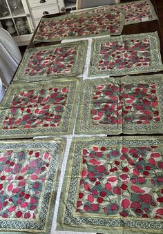 four quilts laid out on a table top