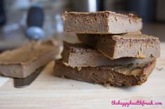 some brownies are stacked on top of each other and ready to be cut into pieces