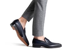 Part of our Magnanni Core Collection, the Romeo is a classic apron toe penny loafer. The Romeo features a modern and slightly elongated toe box to create a sleek silhouette. This timeless design provides versatility to be worn for any occasion. Our signature Bologna construction wraps the foot in leather creating a cushioned footbed and unrivaled flexibility. Classic Fitted Business Slip-ons, Elegant Fitted Tassel Loafers For Business, Classic Fitted Loafers With Branded Insole, Business Fitted Goodyear Welted Loafers, Fitted Formal Loafers With Rubber Sole, Semi-formal Fitted Loafers With Rubber Sole, Goodyear Welted Almond Toe Loafers For Office, Classic Fitted Loafers For Business, Classic Fitted Tassel Loafers For Business