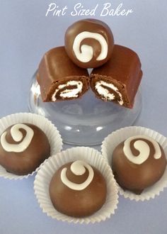 four pieces of chocolate with white frosting on them