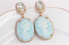 BIG CAMEO EARRINGS, Blue Turquoise Cameo Earrings, Victorian Vintage Bridal Earrings, Chandelier Ice Blue Earrings, Earrings, Gift Details of item: Metal: 24K Gold Plated ( rose or yellow ) or silver plated - Nickel Free Gemstone: crystal and acrylic cameo Earrings Size: 2*0.9 inches The earrings will be packed in a gift box. Ready to ship 1-3 days, FOR MY EARRINGS COLLECTION HERE: https://www.etsy.com/il-en/shop/rebekajewelry?section_id=14222612&ref=shopsection_leftnav_3 TO GET TO MY ETSY S Blue Cameo Jewelry For Wedding, Elegant Turquoise Bridal Earrings, Elegant Turquoise Bridal Earrings For Wedding, Elegant Turquoise Earrings For Wedding, Elegant Turquoise Wedding Earrings, Blue Oval Earrings For Wedding, Vintage Bridal Earrings, Dark Blue Earrings, Climbing Earrings