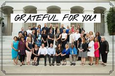 a group of people standing in front of a building with the words grateful for you