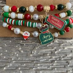 Set Of 4 Merry Christmas Beaded Holiday Charm Bracelets New Merry Christmas Charms, Santa Claus, Seed Beads, Pearls Holiday Festive Jewelry With Colorful Beads, Festive Christmas Beads With Round Shape, Festive Holiday Jewelry With Colorful Beads, Christmas Festive Round Beads, Festive Christmas Beads, Adjustable Colorful Beaded Bracelets For Christmas, Christmas Green Beaded Bracelets, Christmas Gift Beads, Adjustable Christmas Beaded Bracelets