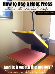 a heat press sitting on top of a desk with the words how to use a heat press