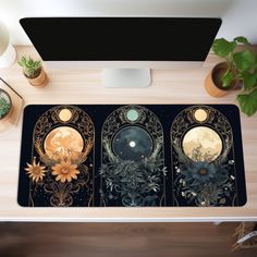 an image of a computer desk with flowers and moon in the sky on it's surface