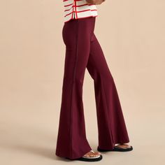 La Ligne Polly Pant Flared Side Velvet Stripes Small Msrp: $395 Color: Burgundy These Pants Were Made For Walking, Strutting, Catwalking, Sashaying, Strolling-Just About Any Mood You Want To Bring To Your Day. Made From A Hold-You-In Blend Of Viscose/Elastane, These Pants Give You The Perfect Line. Pair With Oversize Sweaters, Camisoles And Blazers Or A Simple Tee But Don't Forget L'attitude. 85% Viscose, 9% Polyamide, 6% Elastane Burgundy Stretch Fit And Flare Pant High Waist With Interior Elastic Band Side Zipper Inseam Vent At Hem Tonal Velvet Stripe On Outseam Dry Clean Model Raissa Is 5’10” And Wearing A Size Small. Great Preowned Condition Inseam: 30" Waist: 25.5" Rise: 10.5" Red High-waisted Wide Leg Lounge Pants, Oversize Sweaters, Full-length Red Elastane Pants, Red Non-stretch Wide Leg Pants With Pockets, Stretch Velvet Full-length Bottoms, Aerie Groove-on Rib Velour Flare Pant, Flare Pant, Simple Tees, Sweaters Oversized