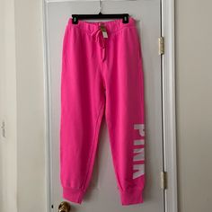 *Victoria's Secret Pink Fleece Joggers *New With Tags *Size: Medium *Color: Hot Pink *"Pink" Logo On Left Leg. *Adjustable Drawstring At Elastic Waistband. *Rib Cuff At Leg Opening. *Inseam: Approx. 27" *Relaxed Fit. *Victoria's Secret Sizing. Not Responsible For Actual Fit. Pink Fall Joggers For Loungewear, Pink Winter Joggers For Loungewear, Pink Joggers For Fall Loungewear, Pink Joggers For Winter Loungewear, Pink Stretch Sweatpants For Winter, Victoria's Secret Loungewear Pants For Spring, Fitted Pink Joggers For Loungewear, Victoria's Secret Bottoms With Elastic Waistband For Loungewear, Spring Loungewear Pants By Victoria's Secret