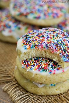 several cookies with sprinkles stacked on top of each other