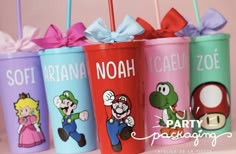 the cups are decorated with mario and luigi's characters on them, as well as bows