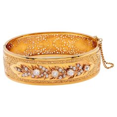 One Belle Époque French Diamond and Pearl 18k Yellow Gold Bangle Bracelet. Featuring four old mine cut diamonds with a total weight of approximately 1.35 carats, graded near-colorless, SI clarity. Accented by 29 seed pearls. Crafted in 18 karat yellow gold with French hallmarks. Circa 1890. The bangle best fits a 6 ½ inch wrist. About this Item: This Belle Époque bangle evokes effortless elegance with its graceful curves and artful design. Handcrafted in France circa 1890, it features 29 seed pe Yellow Gold Bangle, Gold Bangle Bracelet, Gold Bangle, Seed Pearl, Old World Charm, Belle Epoque, Gold Bangles, Bangle Bracelet, Timeless Pieces