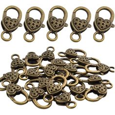 brass plated metal heart shaped clasps, with holes in the middle and hearts on each side