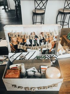 a box filled with personalized items on top of a table