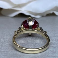 "The ring pictured is lab created ruby #6214 Shown in 14k yellow gold and 14k white gold **Ruby is birthstone of July** -Approximate total carat weight: 3.26ctw. diamond equivalent approx. -Center Stone Size: 9x9mm - approx. 3.20ct. diamond equivalent approx. -Gem Type: Lab created red ruby -Center Stone Shape: asscher cut -Center Stone Color: red -Center Stone Clarity: AAA -Moh's Scale: 9 Hardness -Accent Stones: natural diamonds -Accent Stone Weight: 0.06ctw. Approx. -Accent Stone Color: G -Ac Classic Asscher Cut Ruby Ring For Anniversary, Asscher Cut Ruby Ring With Prong Setting For Anniversary, Yellow Gold Ruby Ring With Round Cut Lab-created Ruby, Asscher Cut Ruby Ring For Anniversary, Ruby Ring With Center Stone In 14k Gold, Gold Ruby Wedding Ring With Center Stone, Round Cut Ruby Ring With Accent Stones For Anniversary, Yellow Gold Birthstone Ring With Round-cut Lab-created Ruby, Gold Ruby Ring With Diamond Cut