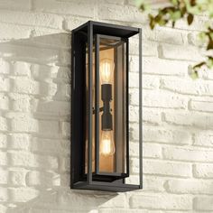 With a design inspired by modern design, the Metropolis outdoor wall light from Possini Euro Design is a shining example of Mid-Century style. A dark textured black finish exterior serves as a sturdy complement to the vibrant soft gold finish accent within this fixture's stellar double box design. Two bulbs rest within a set of clear glass panels, sending light both up and down along the fixture. Pair the Metropolis outdoor wall light with Edison-style vintage bulbs for the perfect look. Size: 2 Bronze Outdoor Lighting, Slots Decoration, Door Lighting, Garage Lights, Outdoor Wall Light Fixtures, Modern Outdoor Wall Lighting, Diy Outdoor Lighting, Exterior Light Fixtures, Exterior Lights