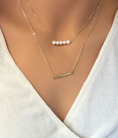 "Dainty Pearl Choker Layered choker Necklace minimalist gold choker Pearl Necklace, Delicate necklace Silver, Gold, 14K Bridal Pearl Necklace Modern, chic, dainty, high quality Pearl Bar Necklace with tiny freshwater pearls, perfect for everyday or any occasions This listing includes a choice of 3 sizes, mini, medium and long bars with genuine 4 mm pearls wire-wrapped with high quality 14 K Gold Fill, Rose Gold fill or Sterling Silver. The flower gold bar is available here: https://www.etsy.com/ Gold Pearl Clavicle Chain Choker, Gold Pearl Choker With Clavicle Chain, Gold Delicate Chain Pearl Choker, Gold Pearl Choker With Delicate Chain, Gold Pearl Choker Necklace With Delicate Chain, Minimalist Pearl Chain Choker Necklace, Gold Layered Clavicle Chain Necklace For Wedding, Minimalist Pearl Chain Choker, Dainty Gold Layered Necklace For Wedding