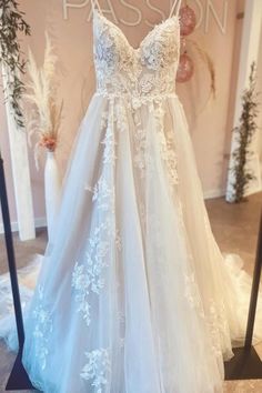 a wedding dress on display at a bridal shop