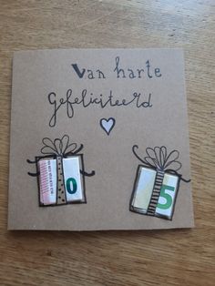 a greeting card with two gift boxes and the words van harte gerfliettend on it