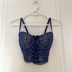 Never Worn. New With Tags. Purchased For $59.50. Can Be Worn As Lingerie Or A Corset Top For Going Out! Blue Lace Fitted Camisole, Blue Fitted Lace Camisole, Fitted Blue Lace Camisole, Victoria's Secret Lace Camisole Top, Blue Fitted Tops With Underwire Support, Fitted Blue Crop Top With Medium Bust Support, Fitted Blue Crop Top, Victoria's Secret Lace Tops Bra Friendly, Blue Corset With Built-in Bra