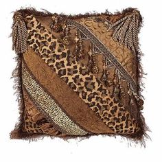 an animal print pillow with fringes and beads