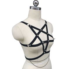 Pentagram Spiked Harness The ultimate punk rock harness - a stunning large five pointed star with metal spikes adorning the straps! O-Ring connectors join the straps together and a delicate two layer metal chain hangs at your waist. One Adjustable Size. Black Punk Harness For Festival, Black Punk Style Festival Harness, Edgy Black Harness For Festivals, Punk Style Party Harness With Adjustable Straps, Punk Harness With Adjustable Straps, Punk Style Harness With Adjustable Straps For Party, Gothic Party Harness With Straps, Adjustable Strapped Gothic Harness, Edgy Party Harness With Straps