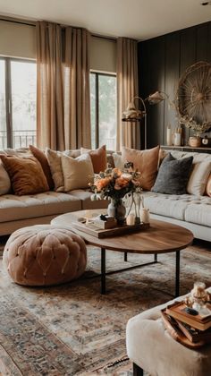 a living room filled with lots of furniture and decor on top of a carpeted floor