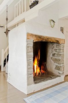 a fireplace in the middle of a living room